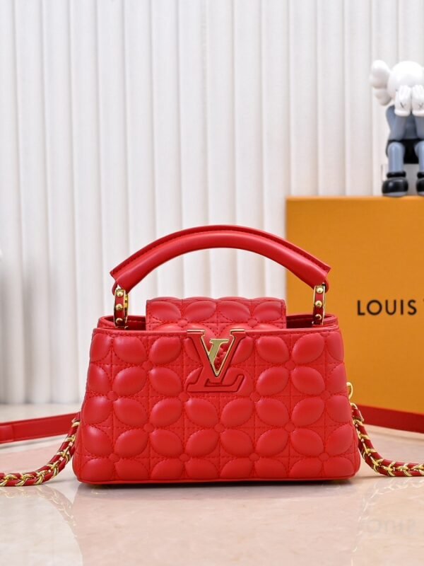 M23998 Red. This Monogram embroidered floral design emerges in the elegant quilting, adding to the Louis Vuitton store's decoration style for the Capucines mini handbag - 22 x 12 x 8 cm