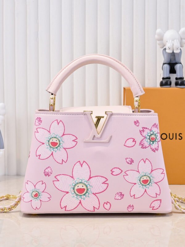 1 Capucines BB model: 13250 Pink Material: Plain weave with graffiti design, upgraded hardware. Highlights: LV logo, unique edge ring, and delicate Monogram flowers on the flip cover. Size: 27×18×9cm