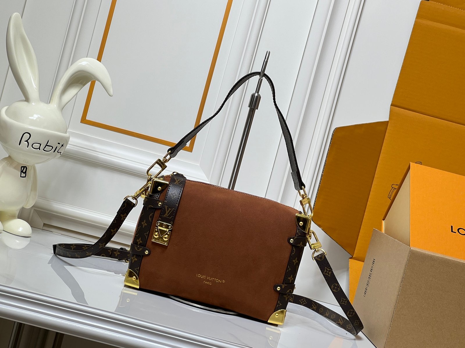 M15072, M46358. This medium-sized Side Trunk handbag is from the