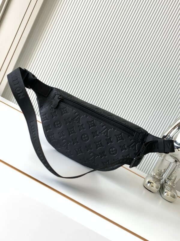 Model No. M46036 - Black Embossed Design. This Discovery waist bag is made of soft Monogram Shadow embossed cowhide leather. Dimensions: 44 x 15 x 9 cm (length x height x width)