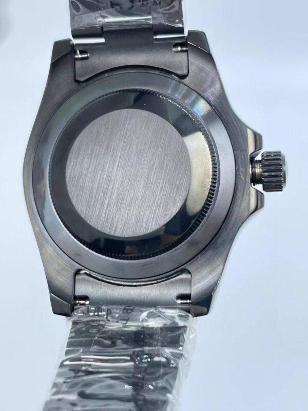 New YM features a black casing paired with a blue dial.  40mm