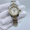Rolex women's model with beaded bezel and Roman numerals, size 26mm