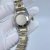 Rolex women's model with beaded bezel and Roman numerals, size 26mm