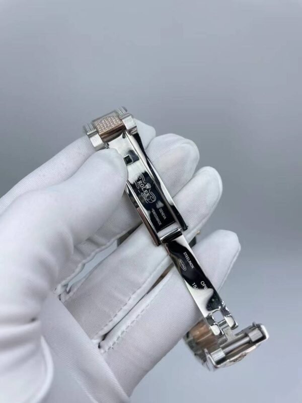 Rolex watch is studded with diamonds and measures 41mm.