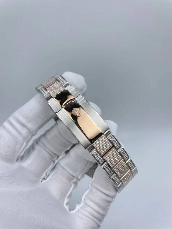 Rolex watch is studded with diamonds and measures 41mm.