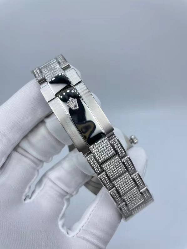 The Rolex minimalist three-stone design model is studded with diamonds and measures 41 millimeters in size.