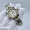 Rolex women's model with beaded bezel and Roman numerals, size 26mm