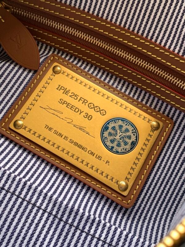 Model number M15282 - Blue fabric Speedy P9 Bandoulière 30 handbag          32 x 22.5 x 18 cm (length x height x width)