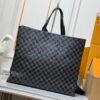 M24457 This medium-sized shopper bag is made by Louis Vuitton and measures 42x34x16 cm.