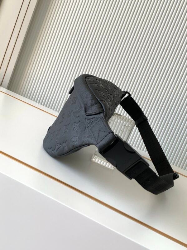 Model No. M46036 - Black Embossed Design. This Discovery waist bag is made of soft Monogram Shadow embossed cowhide leather. Dimensions: 44 x 15 x 9 cm (length x height x width)