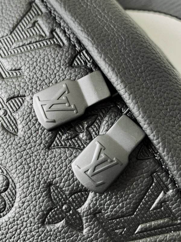 Model No. M46036 - Black Embossed Design. This Discovery waist bag is made of soft Monogram Shadow embossed cowhide leather. Dimensions: 44 x 15 x 9 cm (length x height x width)