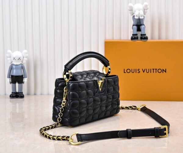 M23998 black. This Monogram embroidered floral design emerges in the elegant quilting, measuring 22 x 12 x 8 cm.