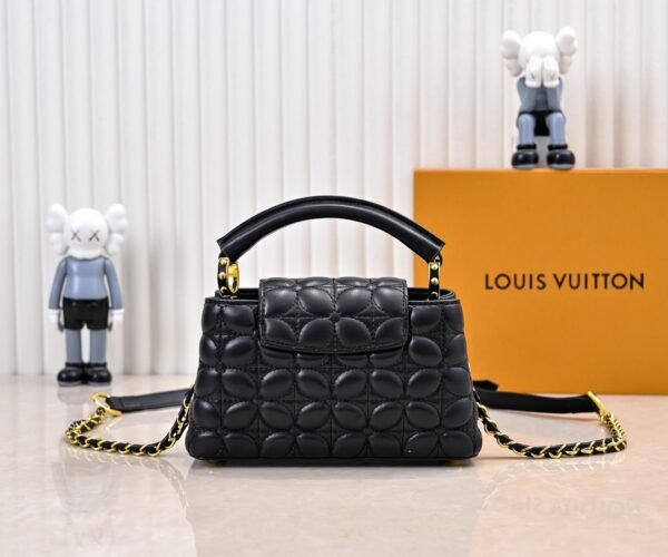 M23998 black. This Monogram embroidered floral design emerges in the elegant quilting, measuring 22 x 12 x 8 cm.