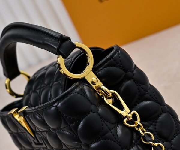 M23998 black. This Monogram embroidered floral design emerges in the elegant quilting, measuring 22 x 12 x 8 cm.