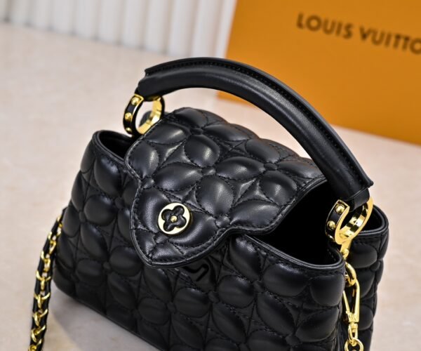 M23998 black. This Monogram embroidered floral design emerges in the elegant quilting, measuring 22 x 12 x 8 cm.