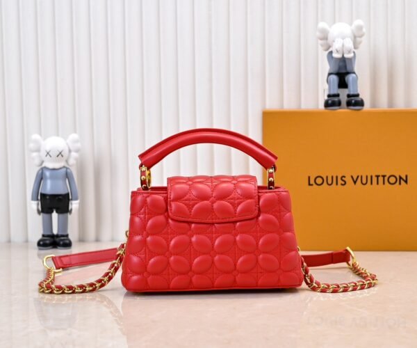 M23998 Red. This Monogram embroidered floral design emerges in the elegant quilting, adding to the Louis Vuitton store's decoration style for the Capucines mini handbag - 22 x 12 x 8 cm