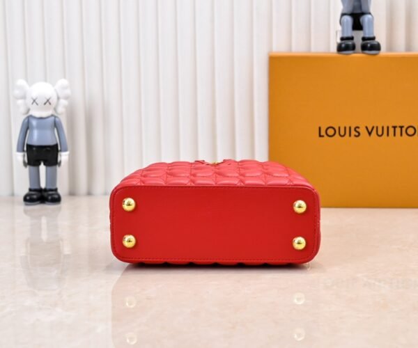 M23998 Red. This Monogram embroidered floral design emerges in the elegant quilting, adding to the Louis Vuitton store's decoration style for the Capucines mini handbag - 22 x 12 x 8 cm