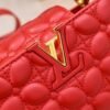 M23998 Red. This Monogram embroidered floral design emerges in the elegant quilting, adding to the Louis Vuitton store's decoration style for the Capucines mini handbag - 22 x 12 x 8 cm