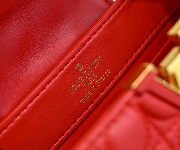 M23998 Red. This Monogram embroidered floral design emerges in the elegant quilting, adding to the Louis Vuitton store's decoration style for the Capucines mini handbag - 22 x 12 x 8 cm