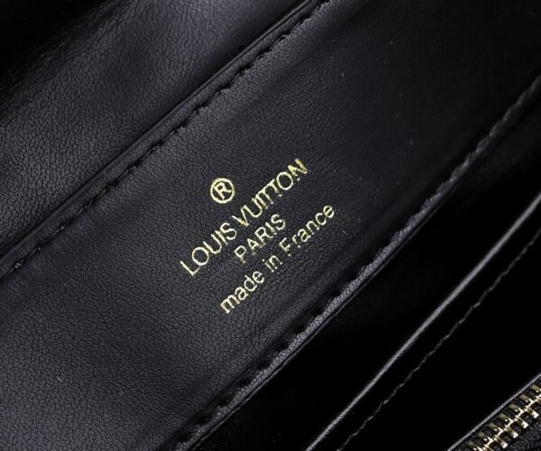 M23999 black. This Monogram embroidered floral design emerges in the elegant quilting, adding to the Louis Vuitton store's decoration style for the Capucines BB handbag. 33 x 19 x 9 cm