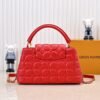 M23999 red. This Monogram embroidered floral design emerges in the elegant quilting, adding to the Louis Vuitton store's decoration style for the Capucines BB handbag. 33 x 19 x 9 cm