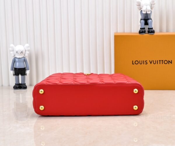 M23999 red. This Monogram embroidered floral design emerges in the elegant quilting, adding to the Louis Vuitton store's decoration style for the Capucines BB handbag. 33 x 19 x 9 cm