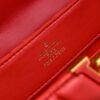 M23999 red. This Monogram embroidered floral design emerges in the elegant quilting, adding to the Louis Vuitton store's decoration style for the Capucines BB handbag. 33 x 19 x 9 cm