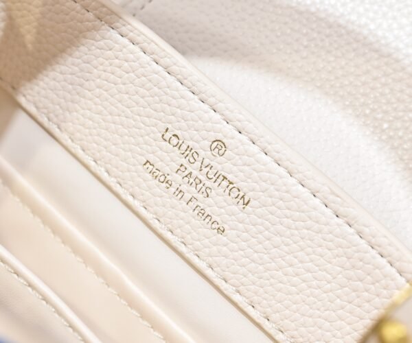 M12947 This Capucines mini handbag measures 21 x 14 x 8.0 cm (length x height x width)