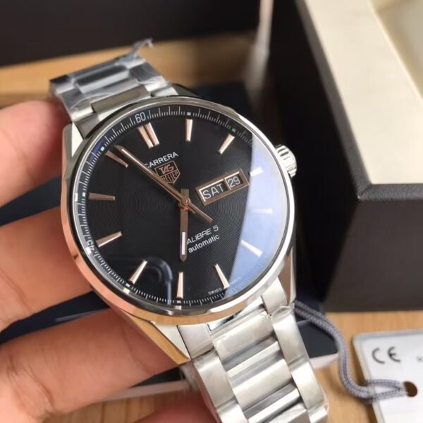 TAG Heuer Carrera Automatic, 41 mm, Steel WAR201C.BA0723 The 41mm day-date model displays the refined the TAG Heuer Carrera styling to perfection. The contrast of black dial and rose gold-plated hands, indexes, logo and Day-Date window is impactful and alluring.