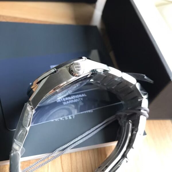 TAG Heuer Carrera Automatic, 41 mm, Steel WAR201C.BA0723 The 41mm day-date model displays the refined the TAG Heuer Carrera styling to perfection. The contrast of black dial and rose gold-plated hands, indexes, logo and Day-Date window is impactful and alluring.